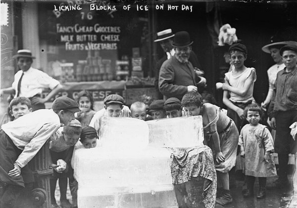 Bain News Service, Publisher, Licking Blocks of Ice on Hot Day, ca. 1910.